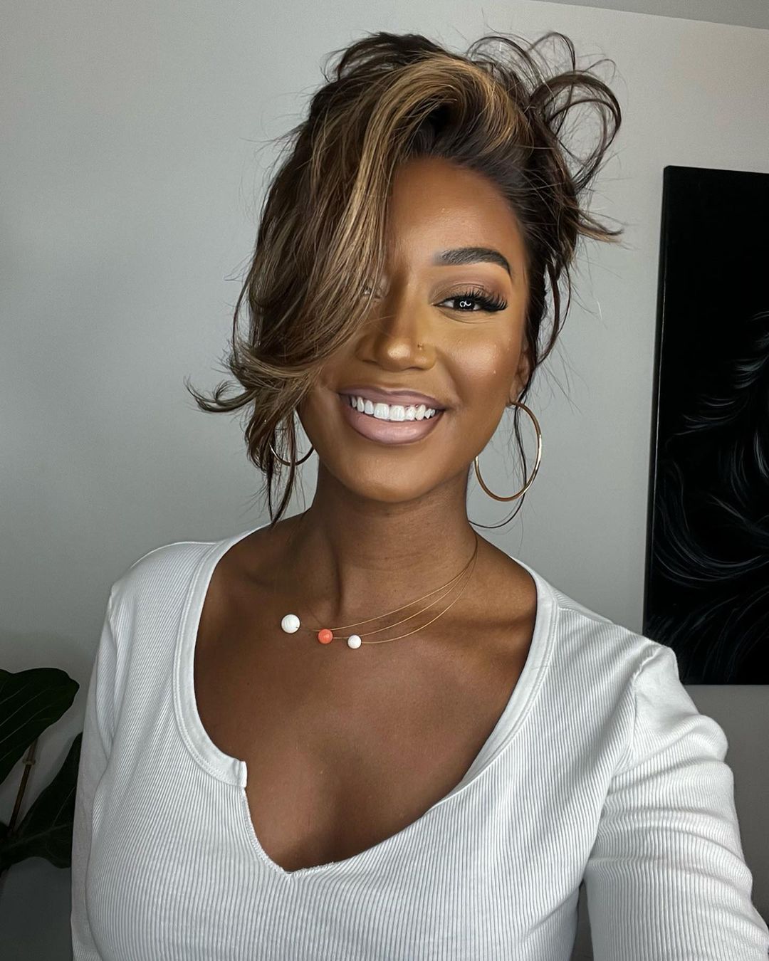 Elegant dark brown human hair lace front wig for women, featuring beautiful blonde highlights & a voluminous wavy style.