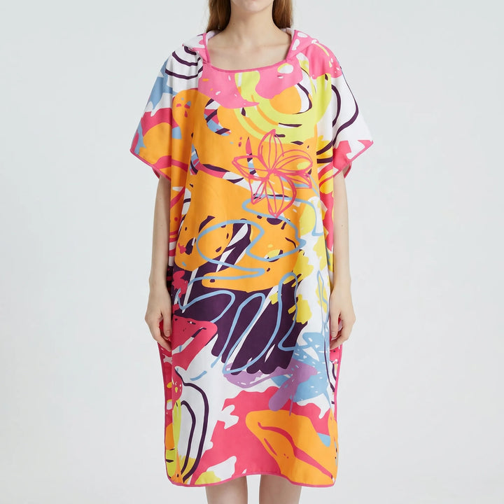 Vibrant print women's hooded towel poncho, perfect as a swim coverup or changing robe for beach and pool fun.
