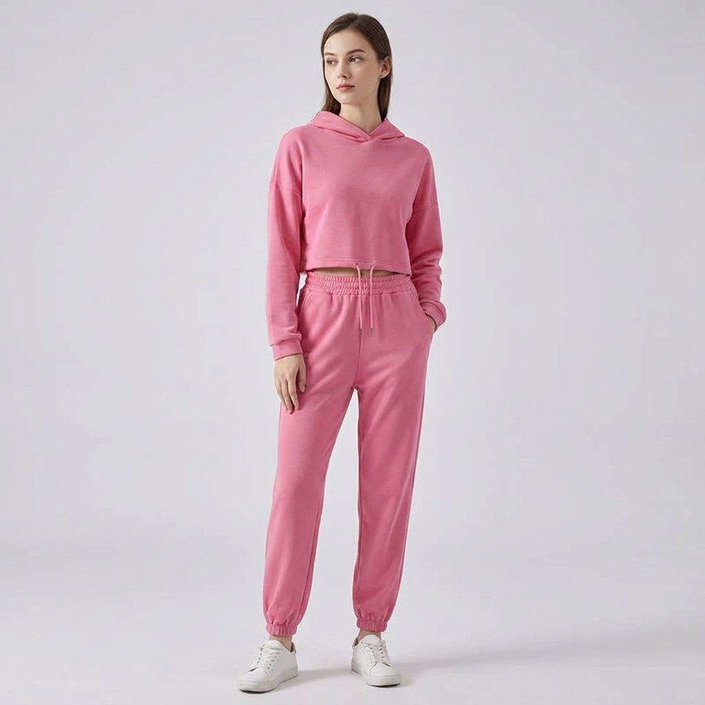 Stylish women's two-piece jogger set with hooded top and high-waisted joggers, ideal loungewear.