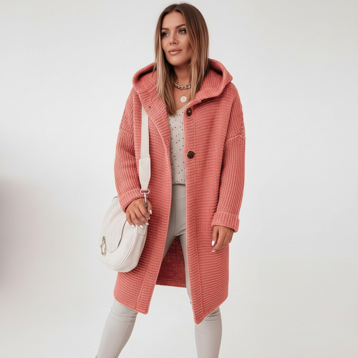 Full-length view of a women's hooded knit vest, highlighting its relaxed fit and modern design
