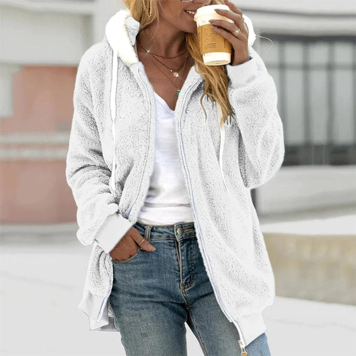 Stylish women's vest with hood, a cozy layer for everyday comfort and autumn fashion.