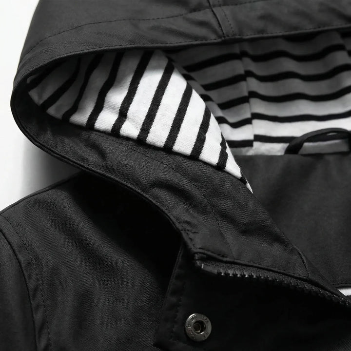 Stylish women's lightweight hooded waterproof jacket, perfect for casual wear & travel.
