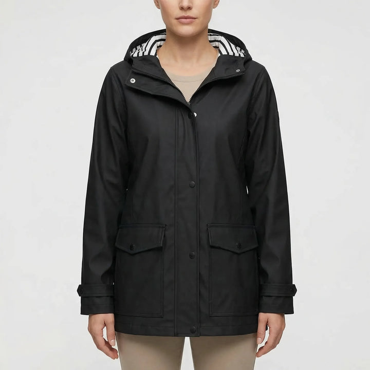 Packable women's travel jacket, waterproof & hooded. Essential lightweight outdoor gear for explorers.