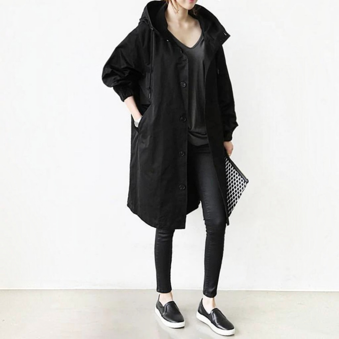 Women's hooded waterproof trench coat, elegant long raincoat for all-season fashion outerwear.