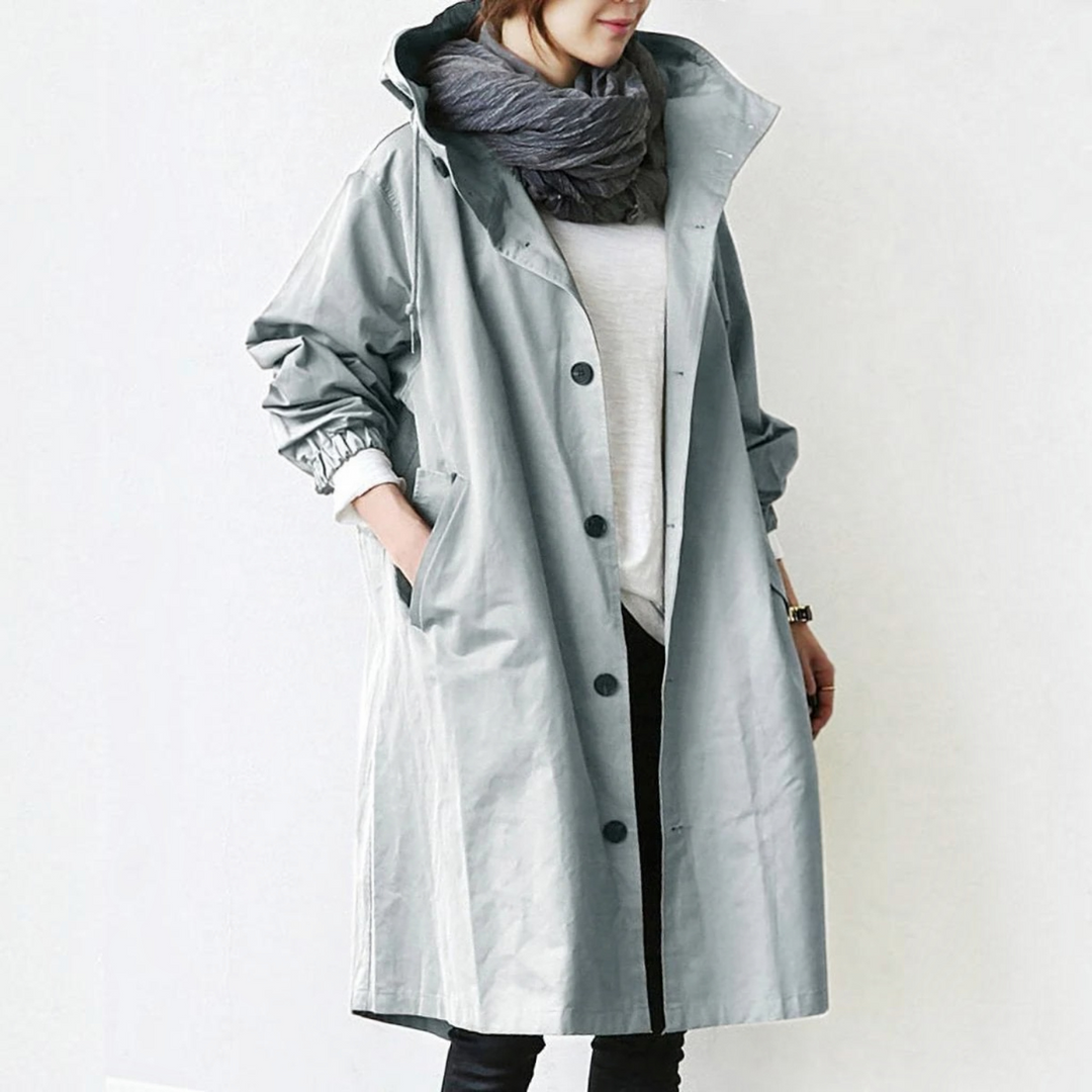 Stylish women's waterproof trench coat with hood, perfect elegant long raincoat for all seasons.