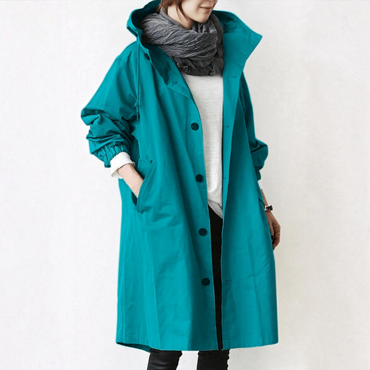 All-season women's hooded waterproof trench coat, elegant long fashion outerwear & raincoat.