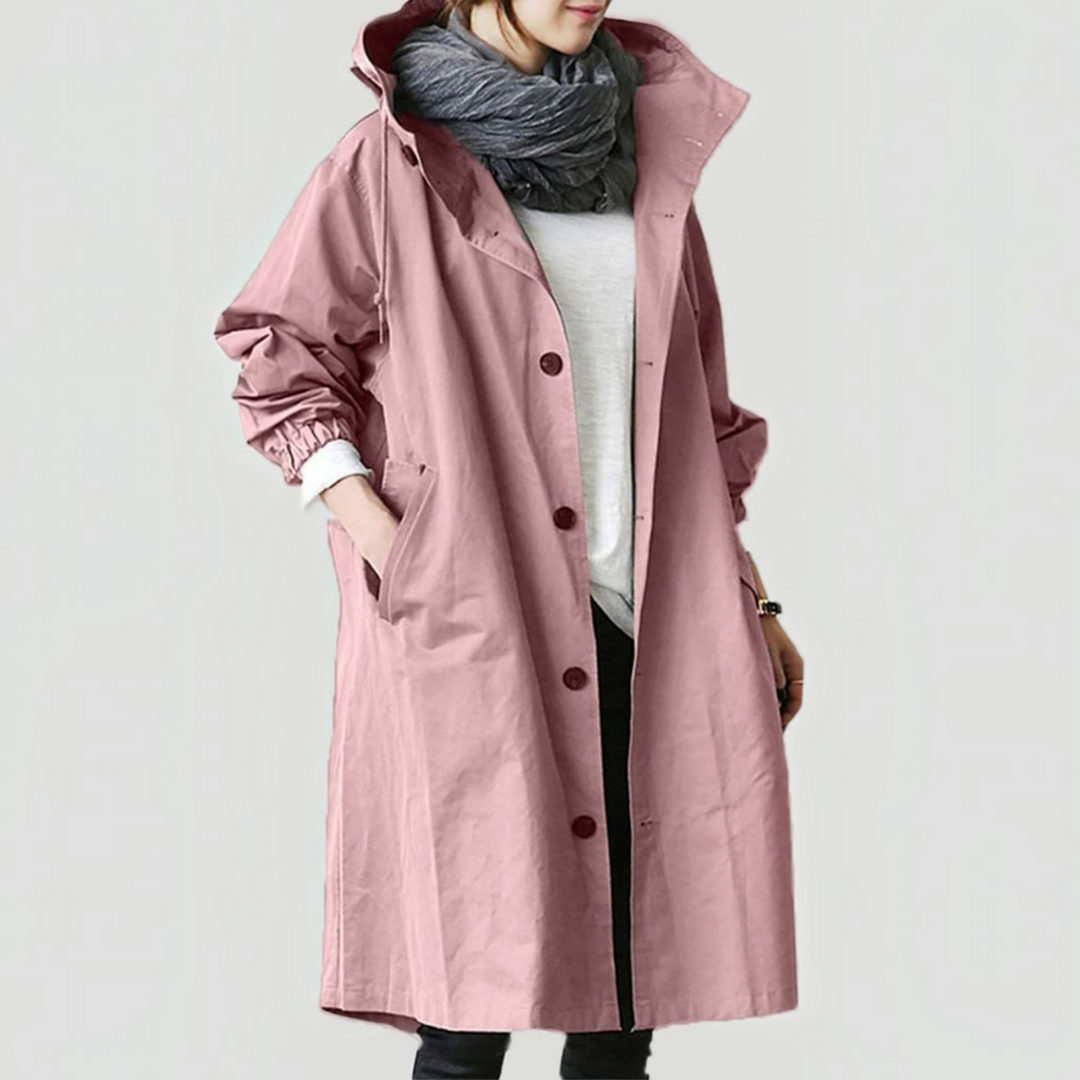 Side view of elegant women's hooded waterproof trench coat, a stylish long raincoat outerwear.