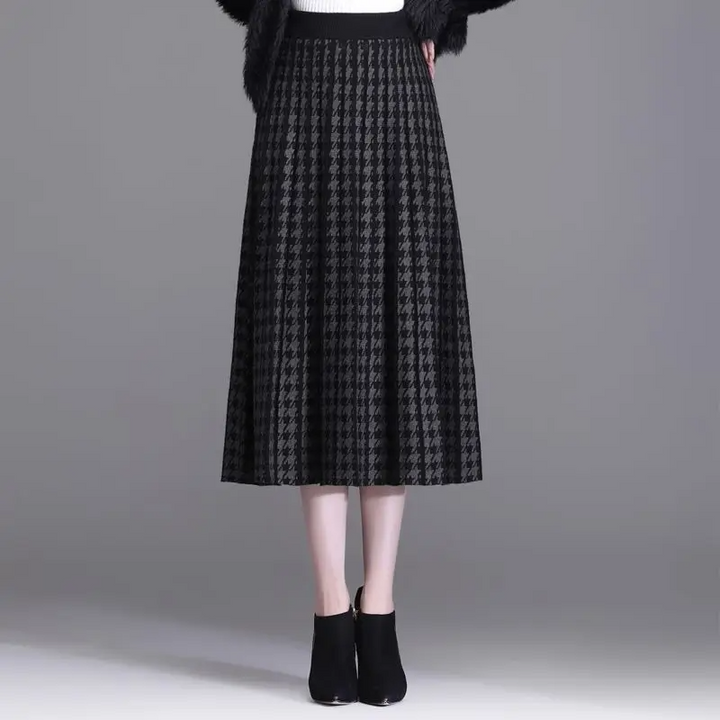 Versatile women's houndstooth midi skirt with elegant pleats. High-waist A-line design, chic for fall and winter office.