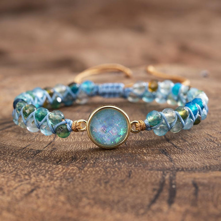 Stack of women's spiritual gemstone bracelets, highlighting the Hypnotic Blue Opal Bracelet