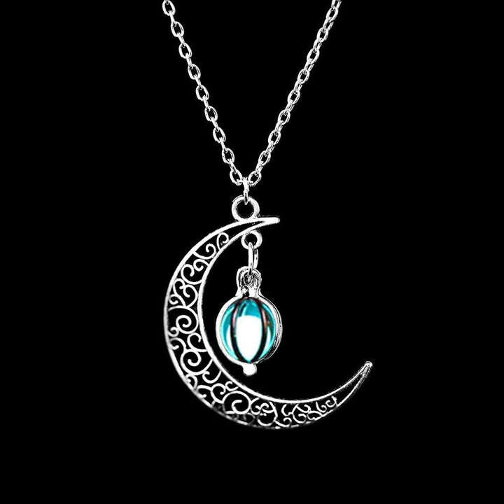 Enchanting glow-in-the-dark moon pendant necklace, mystical silver celestial jewelry for women.