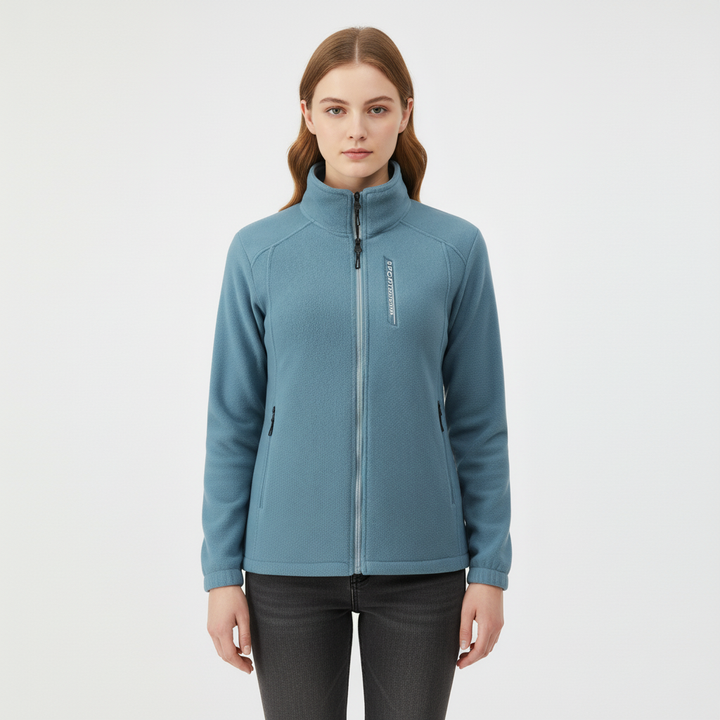 Woman wearing Ingrid thermal fleece jacket outdoors, demonstrating activewear fit & style