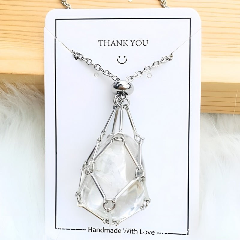 Close-up of women's crystal holder necklace. Intricate design for interchangeable gemstone pendant display.