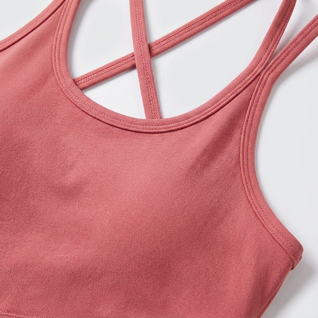 Athletic woman wearing light purple breathable elastane training crop top during a workout