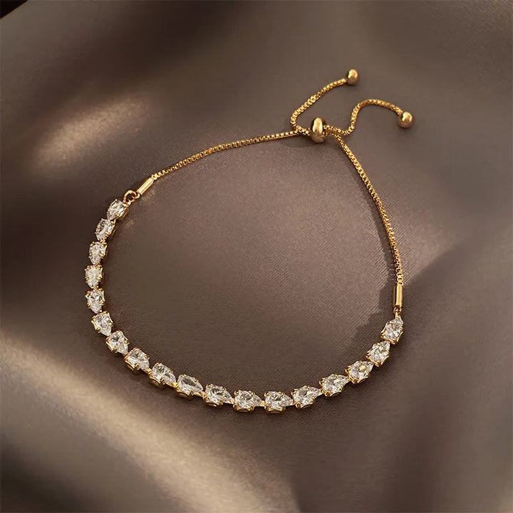 Women's Irish Elegance gold-plated bracelet with intricate Celtic design. Adjustable and elegant fashion accessory.
