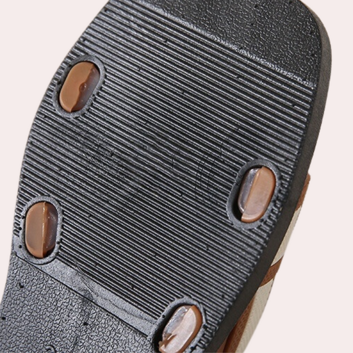 Comfortable Isla flat sandals for women, essential for versatile summer outfits and daily fashion.