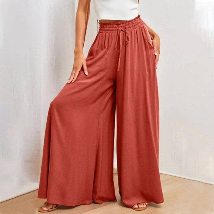 Soft polyester Women's Isla wide leg trousers. High waist design offers comfort and a casual, fashionable look.