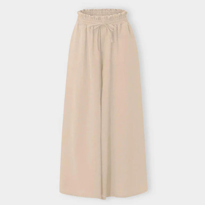 Women's Isla wide leg trousers with high waist. Comfortable polyester fabric for a relaxed yet fashionable vibe.