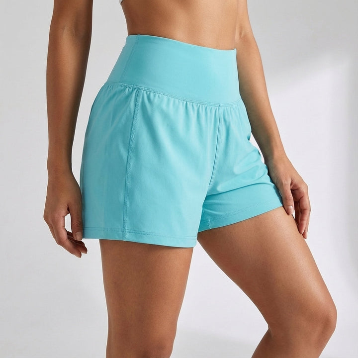 Women's Ivy high-waist 2-in-1 athletic shorts in motion, demonstrating flexibility for running.
