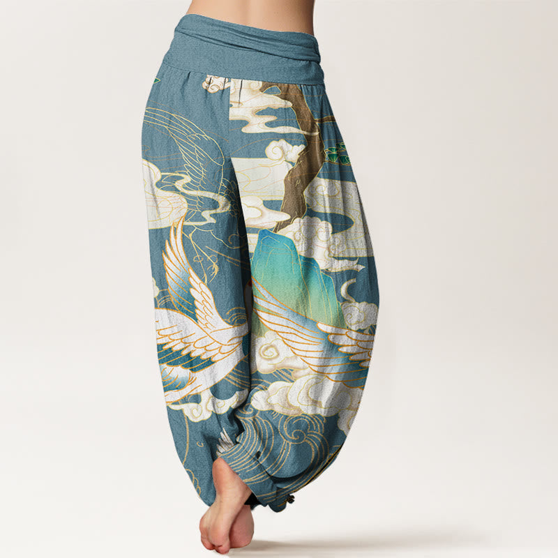 Close-up of vibrant Japanese crane art on women's flowy harem trousers, highlighting the artistic print details.