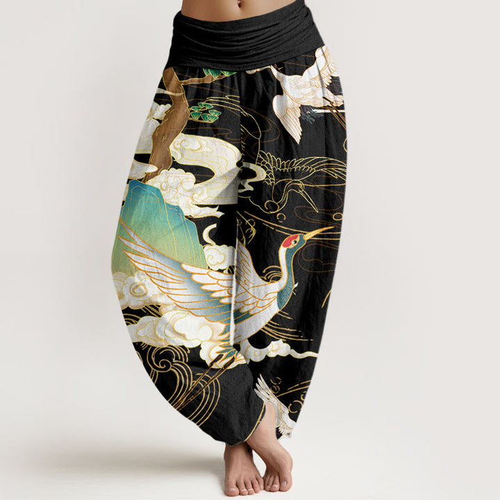 Woman wearing casual bohemian Japanese crane art harem pants, showcasing the comfortable wide leg and unique style.