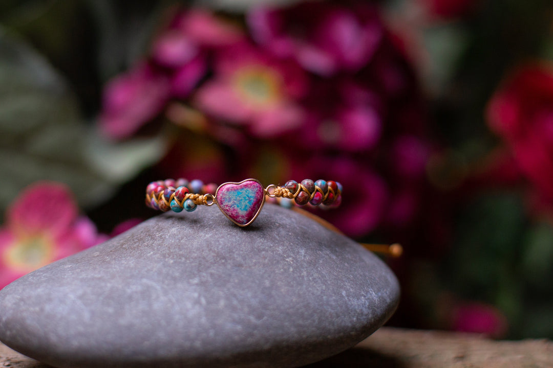 Stacked Jasper crystal healing bracelets on a woman's wrist, showcasing natural gemstone beauty