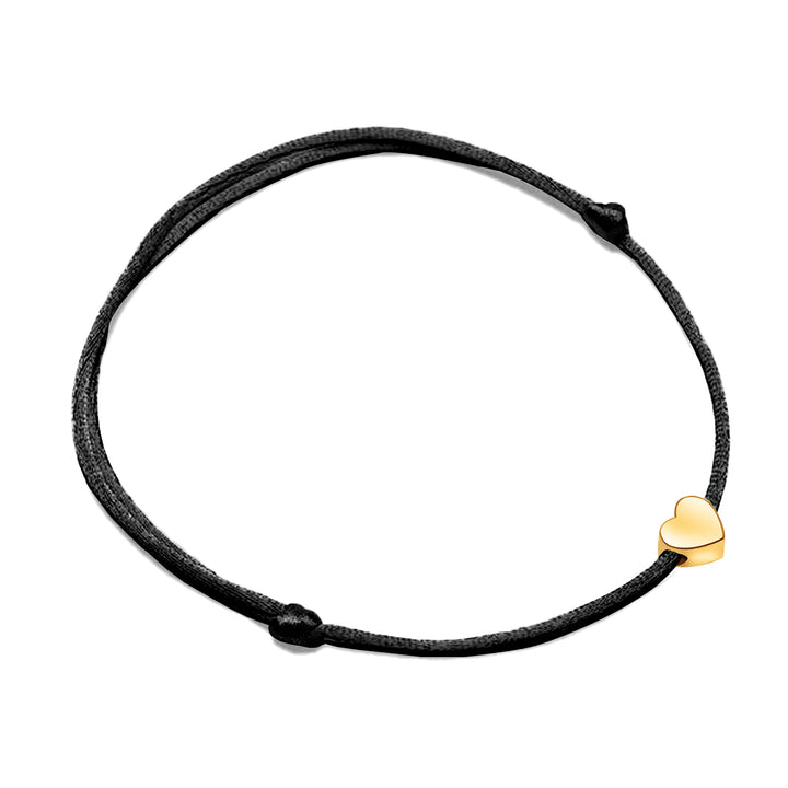 Elegant red adjustable bracelet with a shiny heart charm, a stylish women's jewelry piece