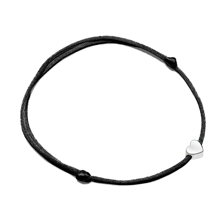 Chic black adjustable bracelet with a minimalist heart charm, versatile women's accessory