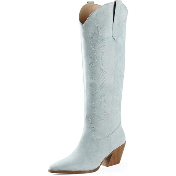 Detailed shot of the pointed toe and block heel on women's embroidered knee-high cowboy boots