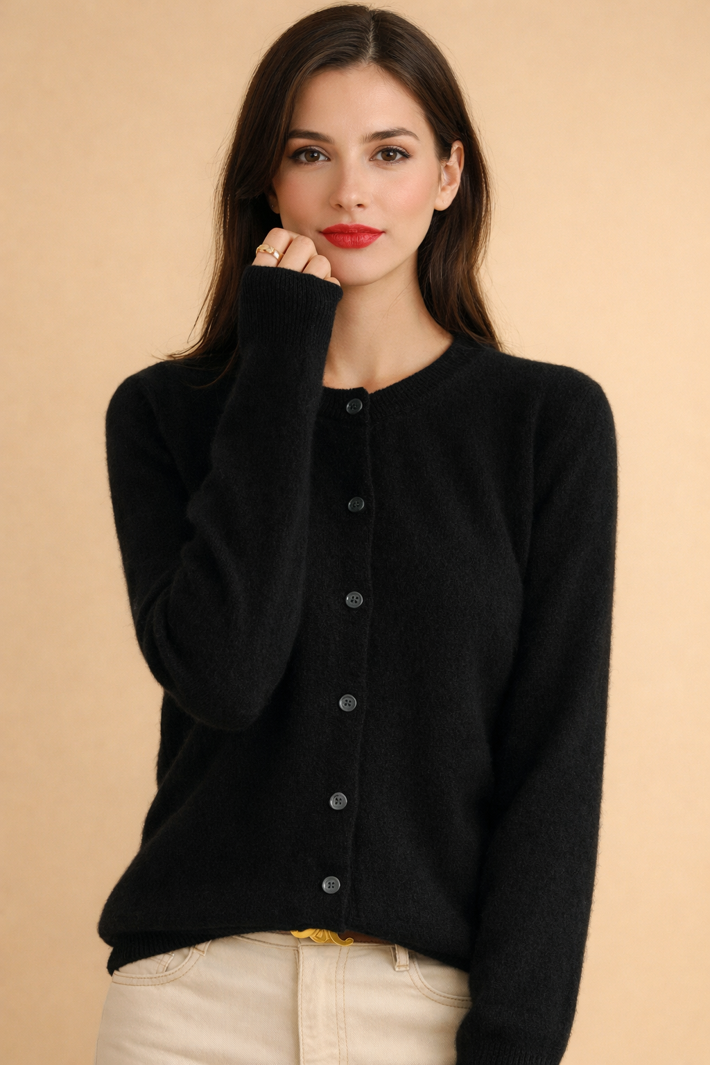 Women's knit cardigan with button-front closure, classic round neck, and long sleeves for versatile layering.