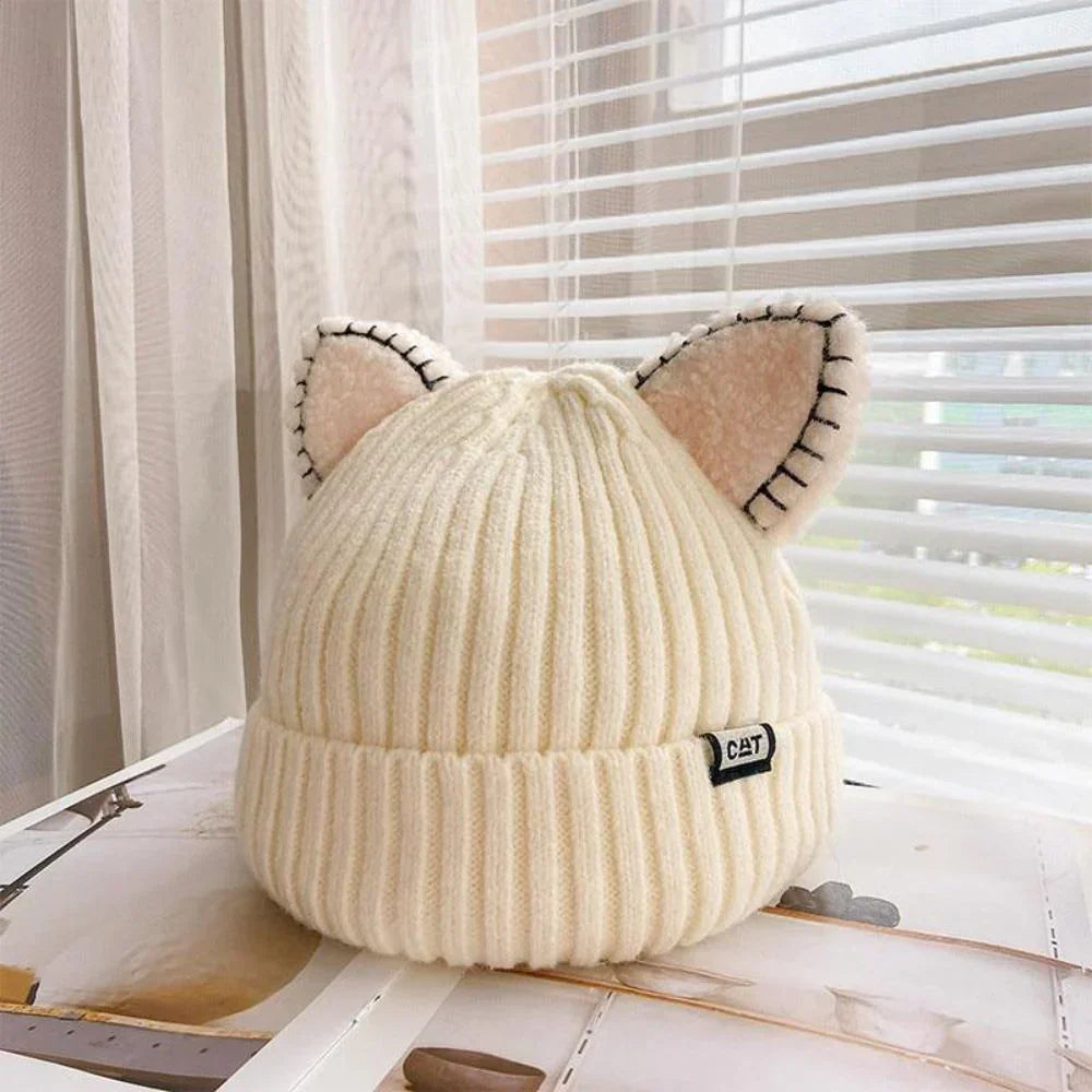 Women's knitted cat ear winter hat in soft yarn, keeping warm and stylish in cold weather