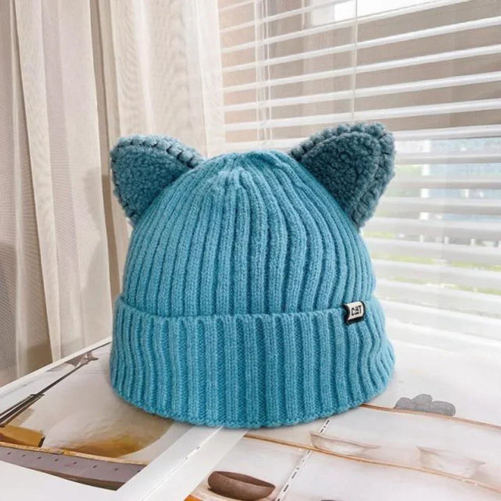 Stylish women's knit hat featuring playful cat ears, perfect cold weather fashion headwear