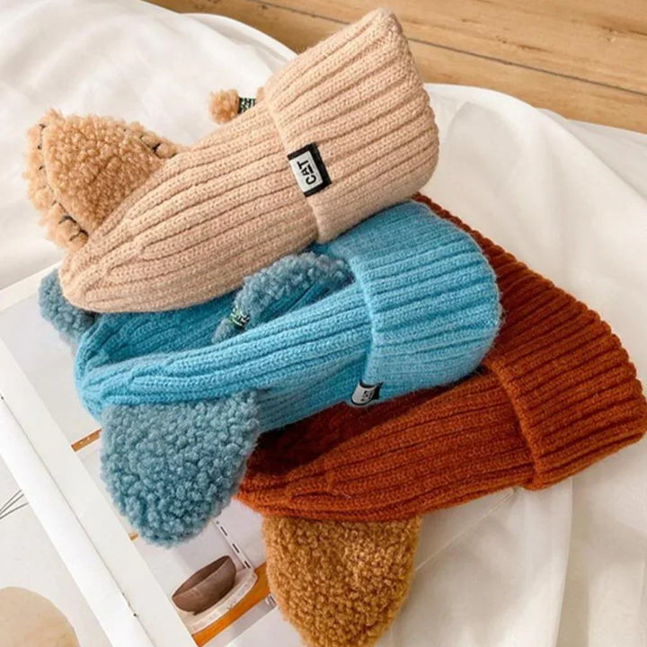 Elegant women's knitted hat with cat ears, offering warmth and a modern winter fashion statement