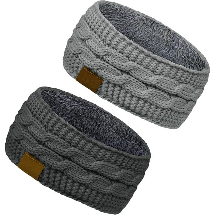Model smiling, wearing a Cathryn knitted ear warmer headband, demonstrating its snug and warm fit.