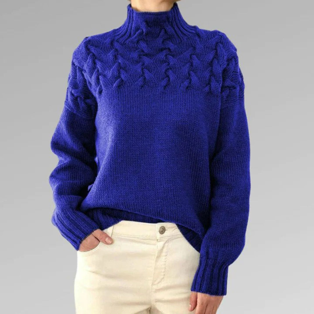 Woman wearing an elegant knitted turtleneck sweater, showcasing classic style for winter fashion.