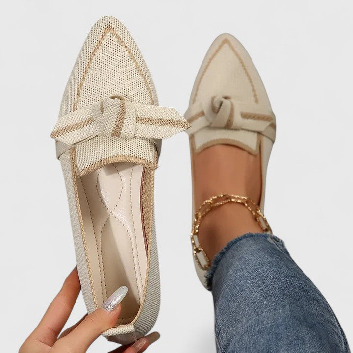 Womens pointed-toe flat loafers with a stylish knot front, easy slip-on shoes for elegant comfort.