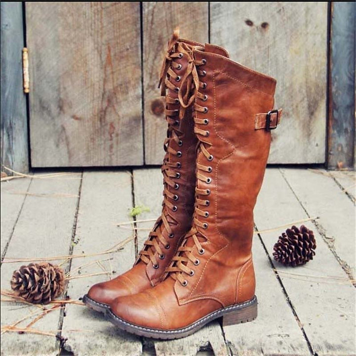 Women's lace-up knee-high riding boots for casual everyday wear, stylish and comfortable fall/winter footwear.