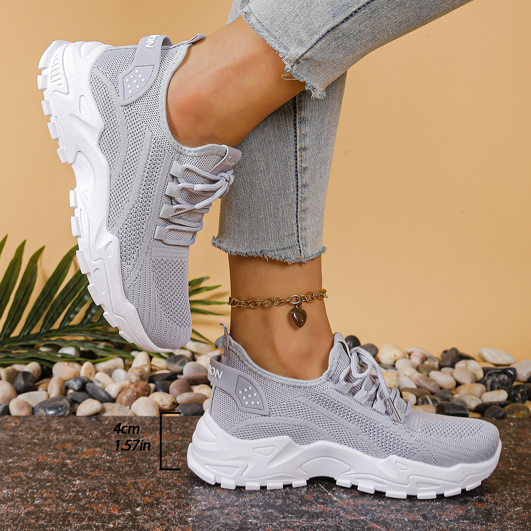 Women's supportive orthopedic athletic sneakers, lace-up design for cushioned all-day comfort.