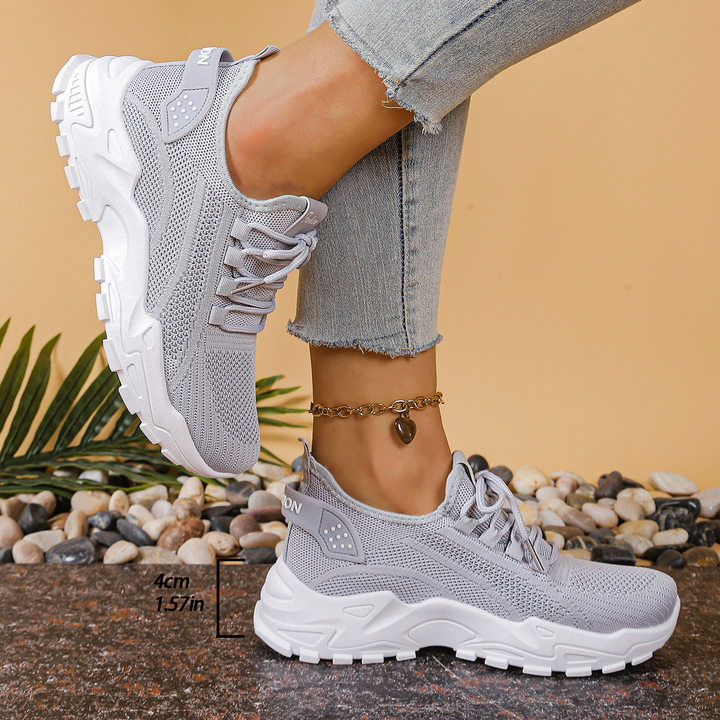 Women's supportive orthopedic athletic sneakers, lace-up design for cushioned all-day comfort.