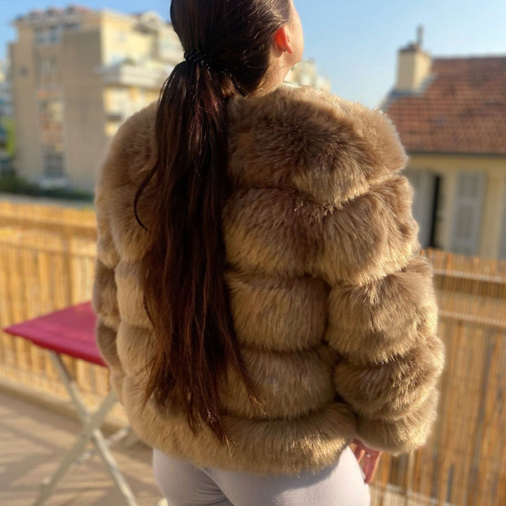 Detail of the soft plush fabric and elegant design of the Lana women's warm winter coat, a chic ladies jacket.