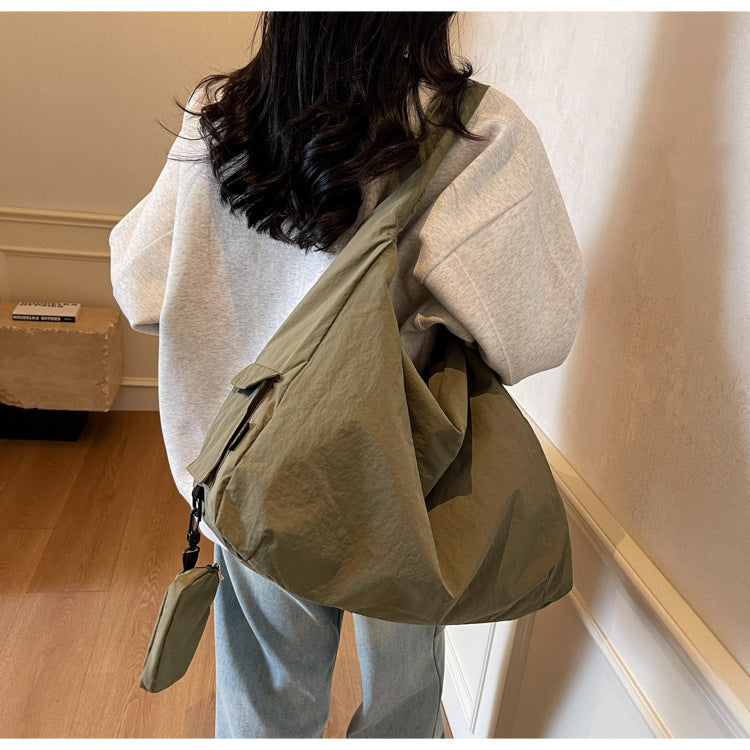 Women's large capacity crossbody bag, perfect for everyday style & travel convenience.
