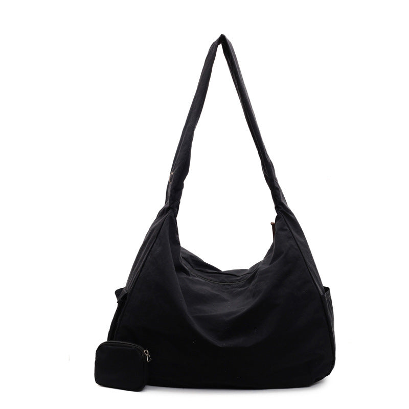 Women's large capacity hobo bag, chic shoulder bag for everyday versatility.