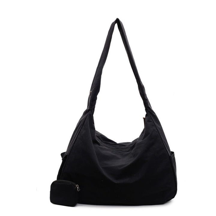 Women's large capacity hobo bag, chic shoulder bag for everyday versatility.