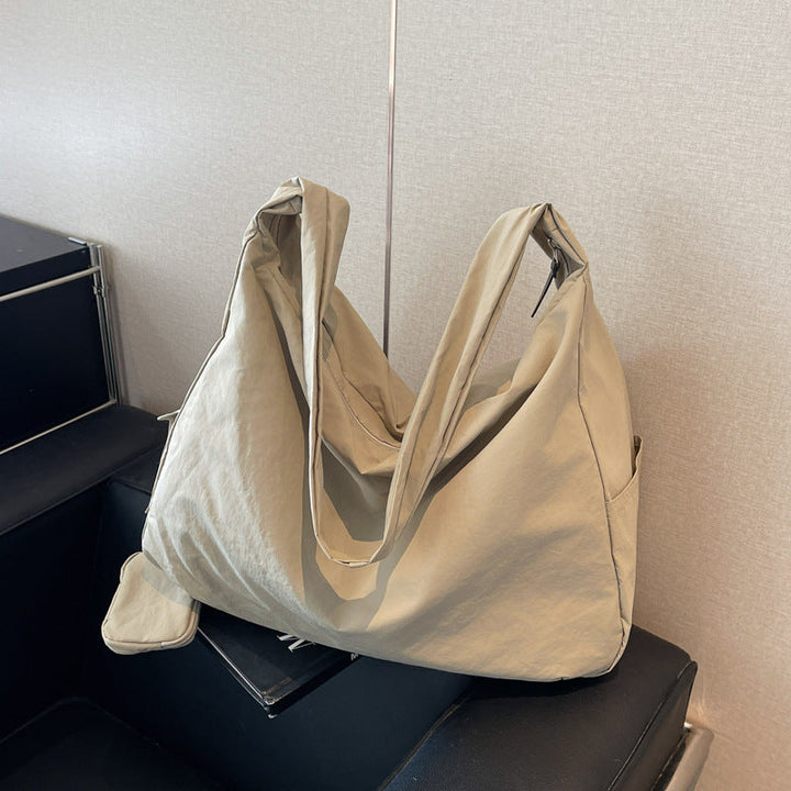Stylish women's hobo shoulder bag with large capacity, ideal for daily use.