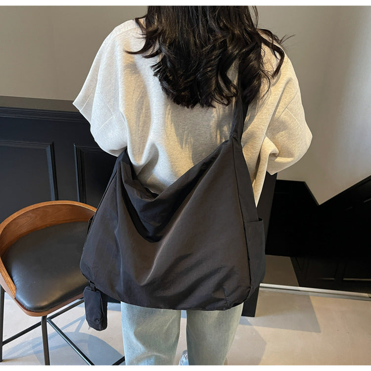 Women's travel crossbody bag with ample space, stylish & convenient for daily errands.