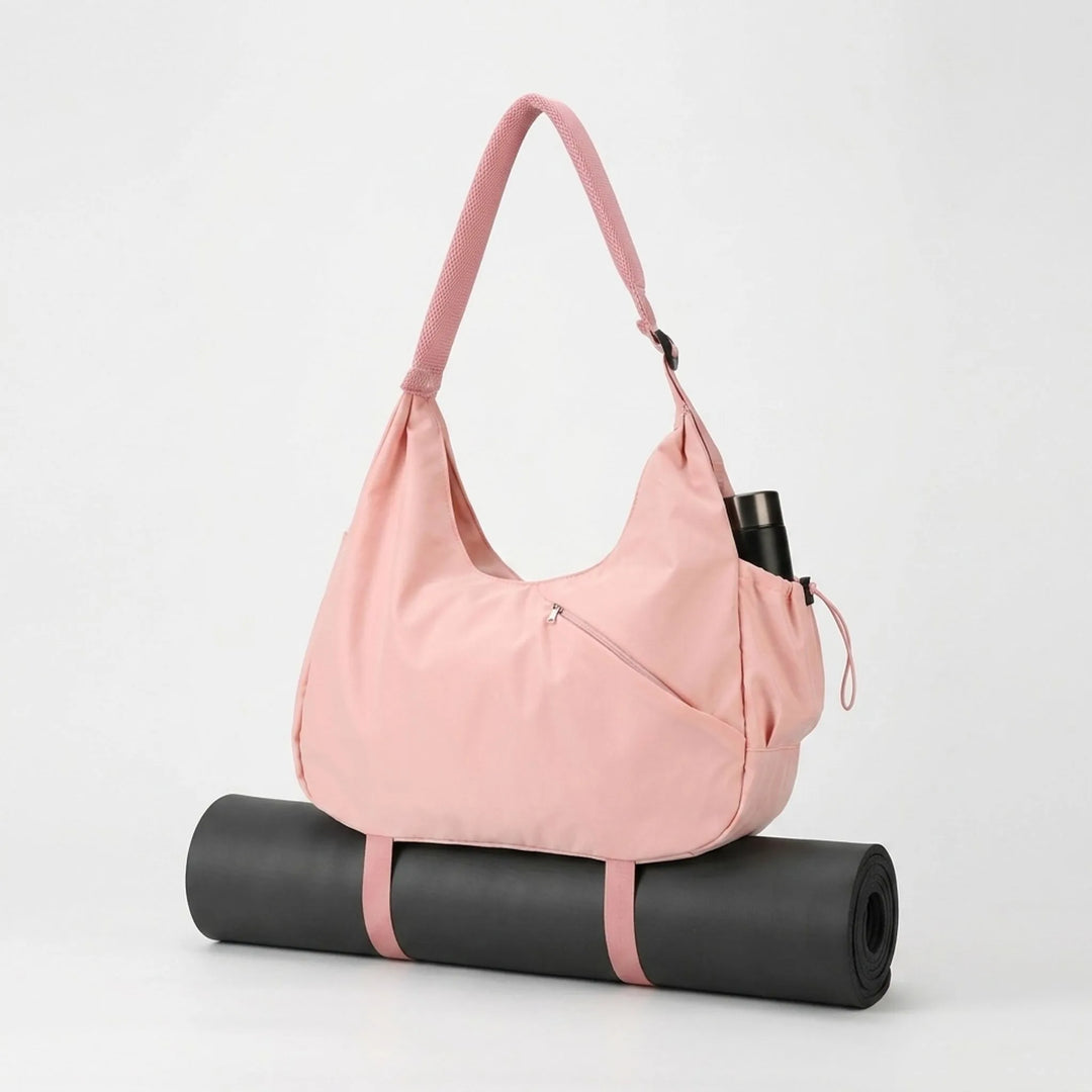 Stylish polyester women's gym bag, a large fitness tote with external straps for a yoga mat.