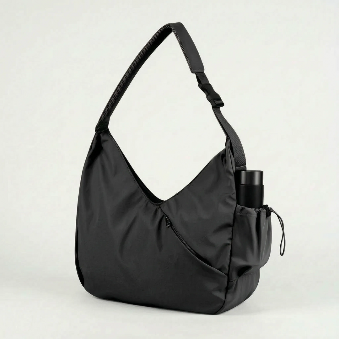 Versatile women's sport bag. Large polyester fitness tote with integrated yoga mat straps for active women.