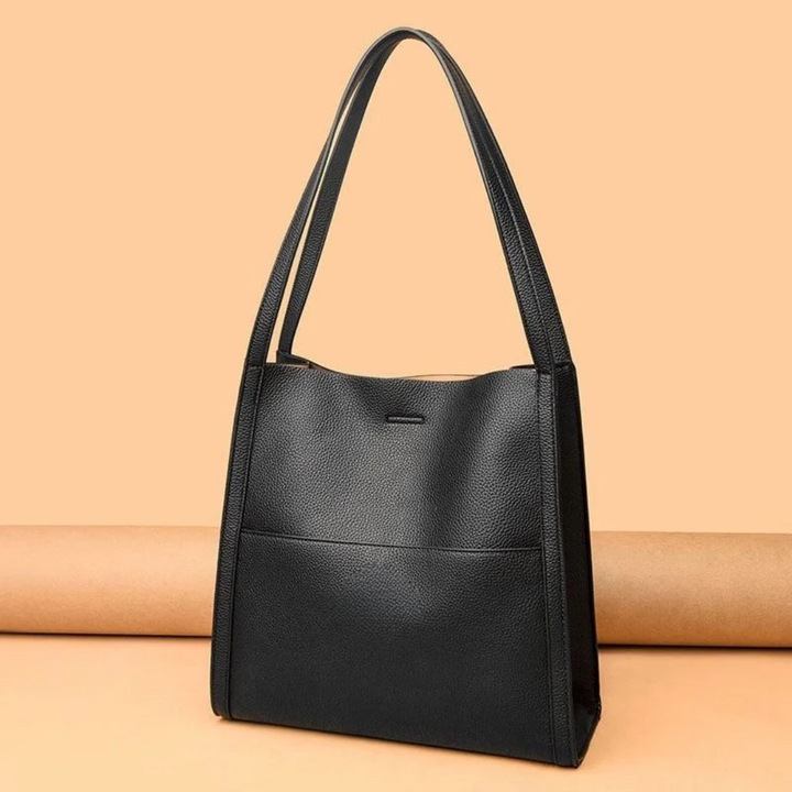 Women's large leather tote handbag, spacious for daily essentials & stylish for everyday use.