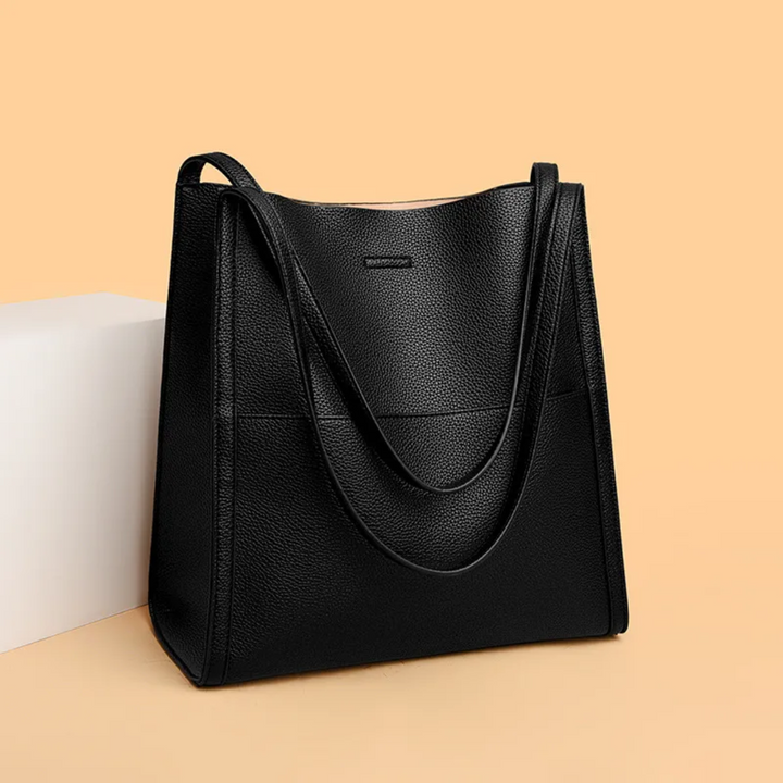Modern gray large leather tote handbag for women, spacious everyday shoulder bag with stylish design.