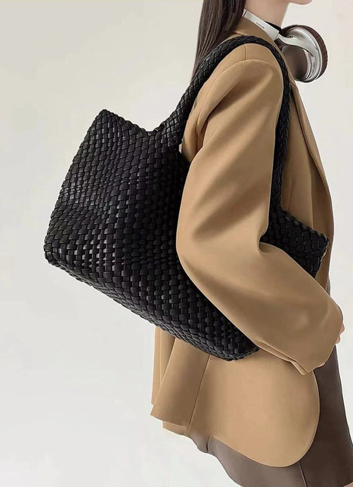 Durable women's large woven tote bag, a fashionable shoulder carryall for daily elegance.