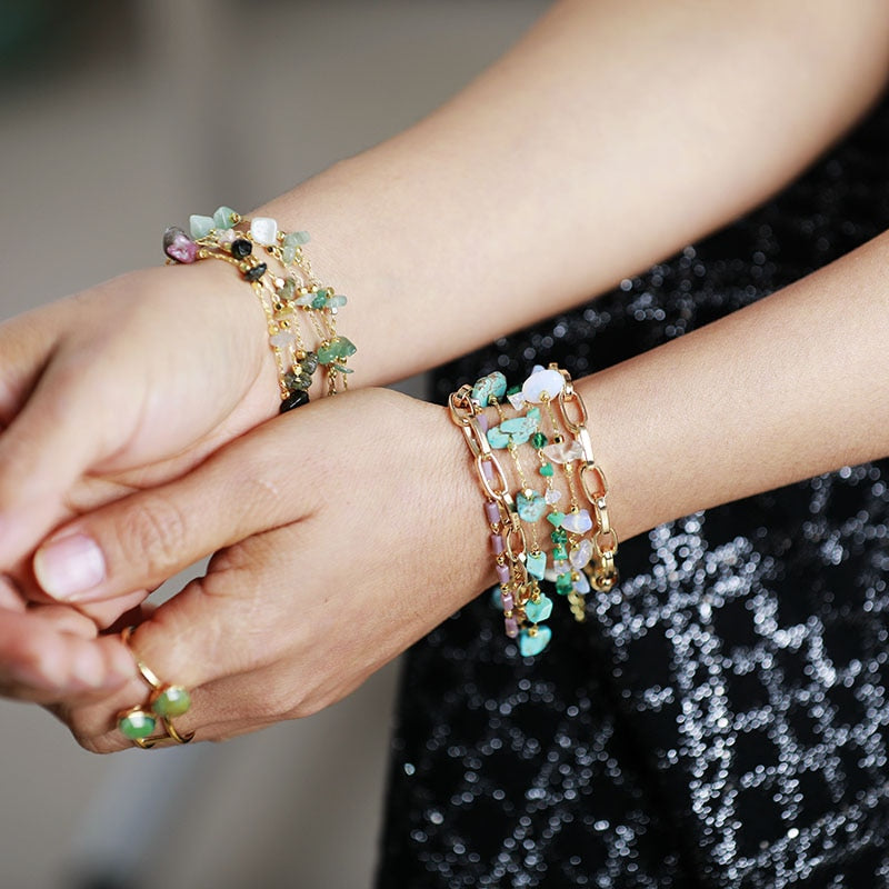 Styled shot of a women's layered turquoise and opal gemstone bracelet, perfect for any outfit.